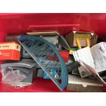 A box containing a collection of OO gauge railway accessories including buildings, trackside