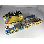 A collection of racing vehicles. A Corgi UOP Shado