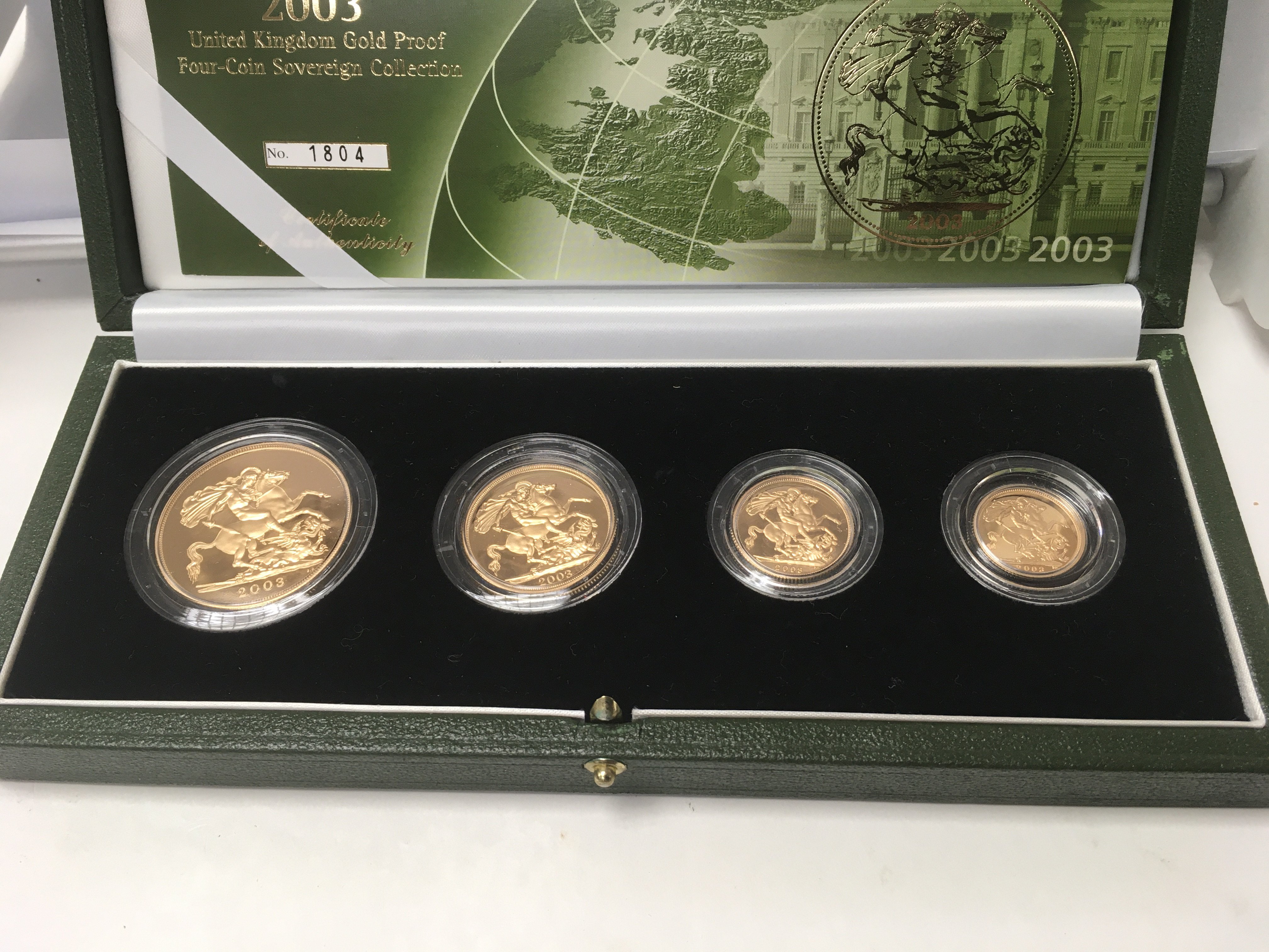 A gold 2003 four coin sovereign collection compris