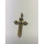 A 18 ct yellow and white gold cross pendant 3 cm ,