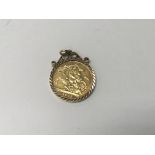 A 2000 gold full sovereign on mounted pendant.