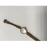 A small 9ct gold case laddies wristwatch the dial