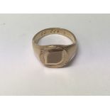 A 9 ct gold gent's ring 7 grams size S .