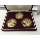 A set of Three commemorative £5 gold coins Prince