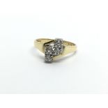 An 18ct gold ring set with four diamonds, approx 3.4g and approx size J-K.