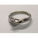 A white gold ring set with a solitaire diamond.ring size L
