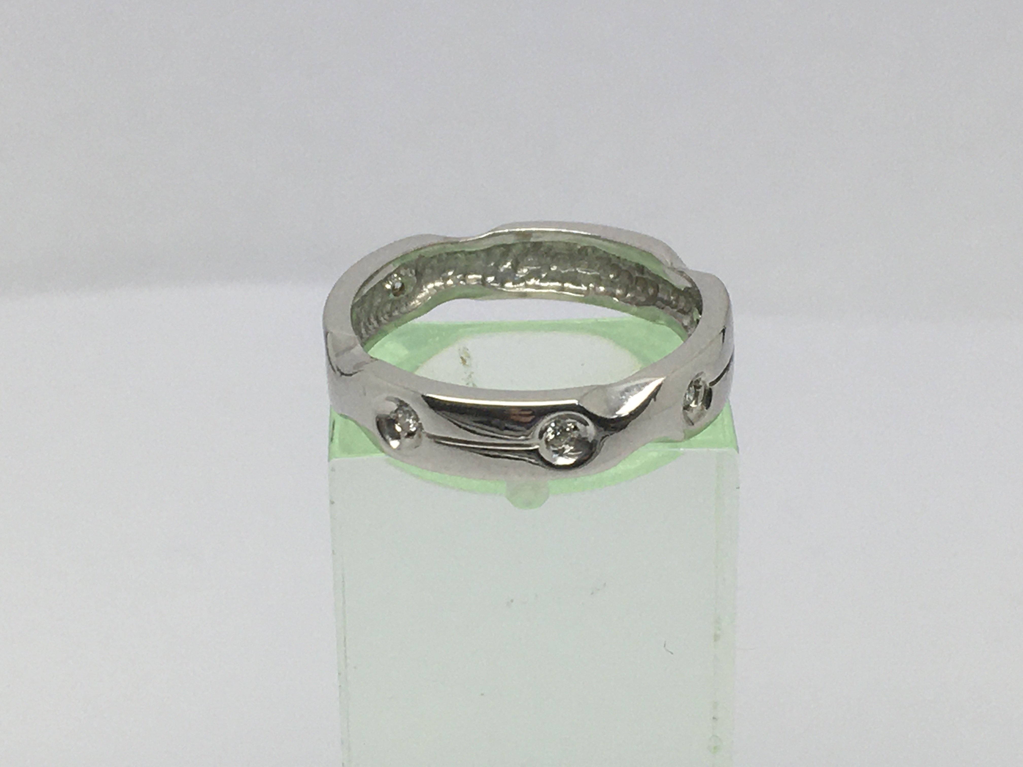 An 18ct white gold six diamond ring, approx 3.7g and approx size N-O.