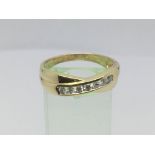 An 18ct gold seven stone diamond crossover ring, approx.33ct, approx 4.7g and approx size U-V.