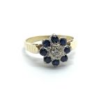 An 18ct gold sapphire and diamond cluster ring, approx 3.2g and approx size I.
