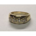 An unusual 18carat gold ring set with alternating brilliant cut and baguette diamonds. Total