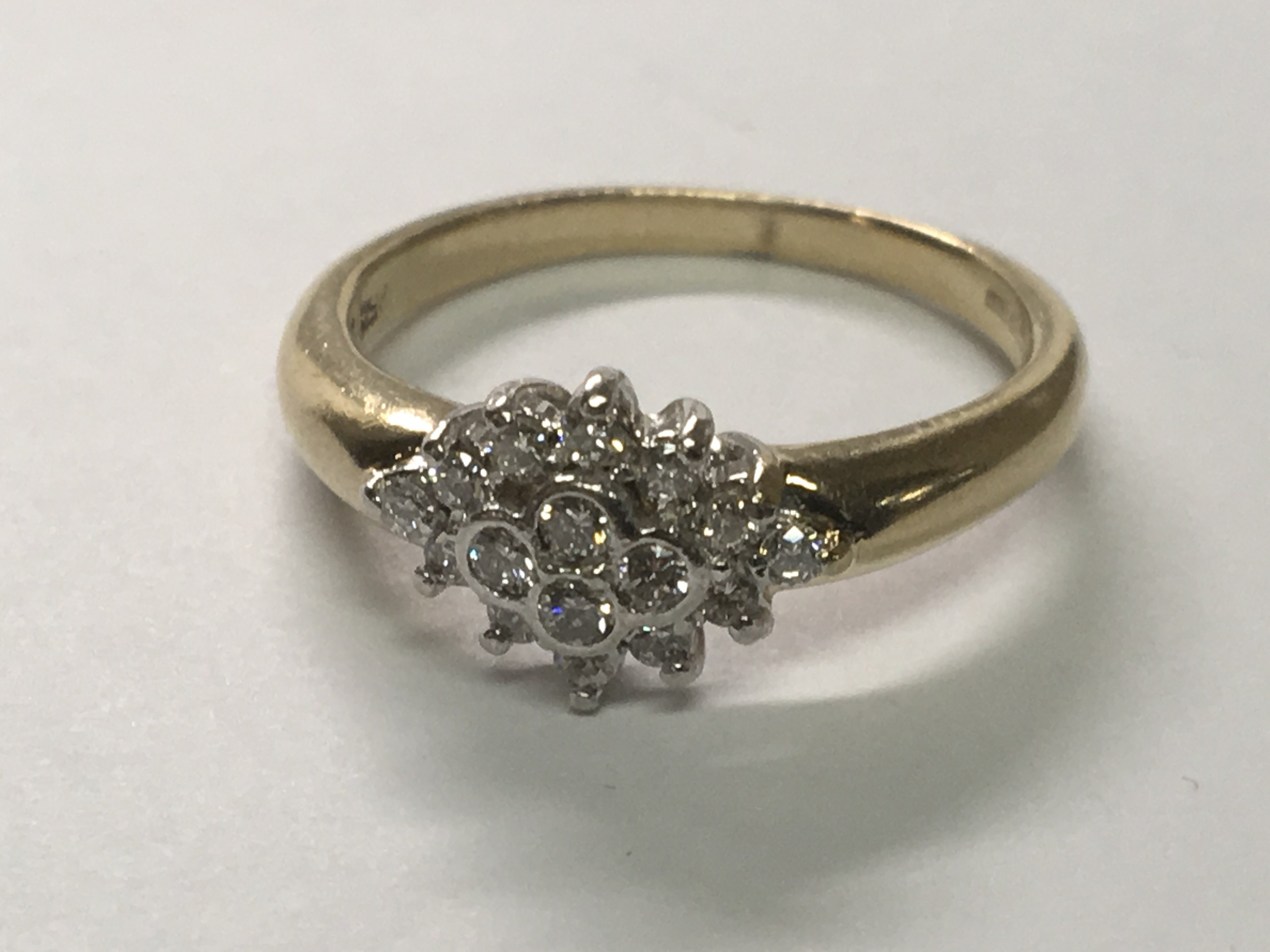 A 9carat gold ring set with a pattern of sixteen brilliant cut diamonds.ring size P. - Image 2 of 2