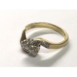 An 18carat gold ring diamond cross over with further diamonds to the shank. ring size K.