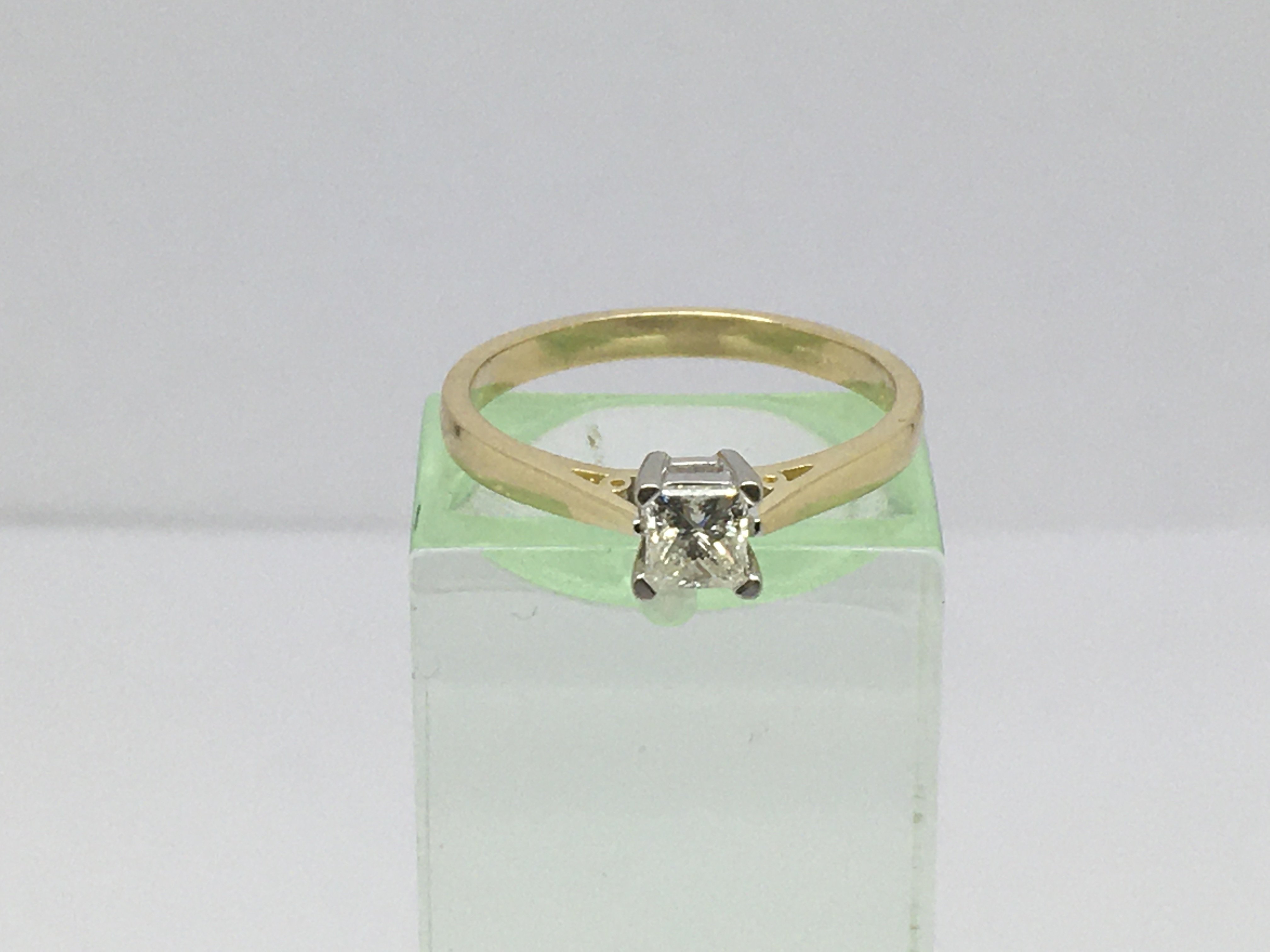 An 18ct gold princess cut solitaire diamond ring, approx.33ct, approx 2.5g and approx size L.