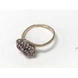 A 9ct gold ruby and diamond set ring. (J).