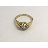 A gents 18ct gold gypsy ring, approx .20ct, approx 5.3g and approx size T.