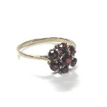 A gold ring set with garnets. Ring size R.