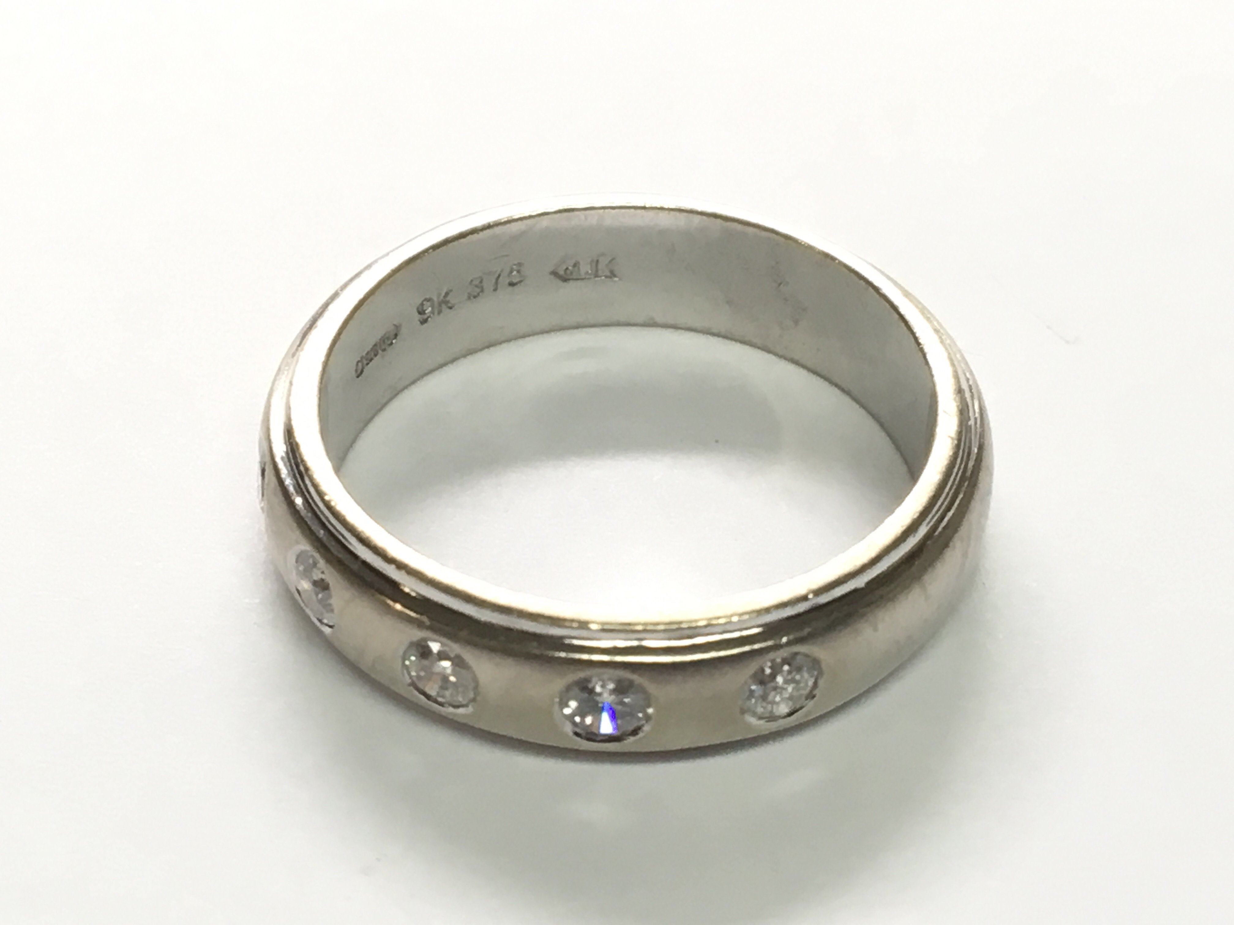 A 9carat white gold ring set with diamonds approximately 0.25 carat ring size N.