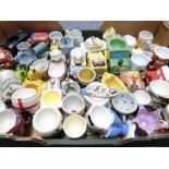 Approximately 50 novelty egg cups including retro, kitsch, Japanese, pottery including Ardmore,