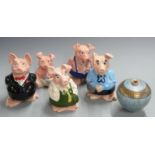 Set of five Wade NatWest pigs and a studio pottery vase, signed TL '98 and with fish cipher