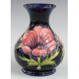 Moorcroft pedestal vase decorated in the Anemone pattern, dated 1994, H16cm