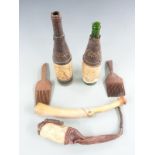 Nigerian tribal items from Bonny area circa 1900, including carved bone (musical) horn, combs,