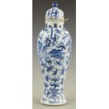 Chinese blue and white lidded vase with dragon decoration, 23cm tall