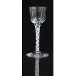 An 18thC drinking glass with white double twist stem and ogee shaped bowl raised on conical foot,