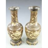 A pair of Japanese Meiji period lacquer pedestal vases decorated with gilt dragons, H42cm