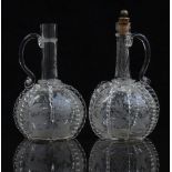 A pair of 19thC Dutch glass decanters engraved with scenes of birds and foliage, each