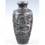 A Chinese carved cinnabar lacquer vase with dragon decoration, 21.5cm tall