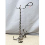 A wrought iron welded companion stand in the form of a fouled anchor, H68cm