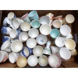 Approximately 42 large novelty egg cups including Royal Doulton, blue and white etc