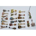 Twenty-two Hard Rock Café pin badges all in the form of guitars including Rome, Oralndo, Beijing,