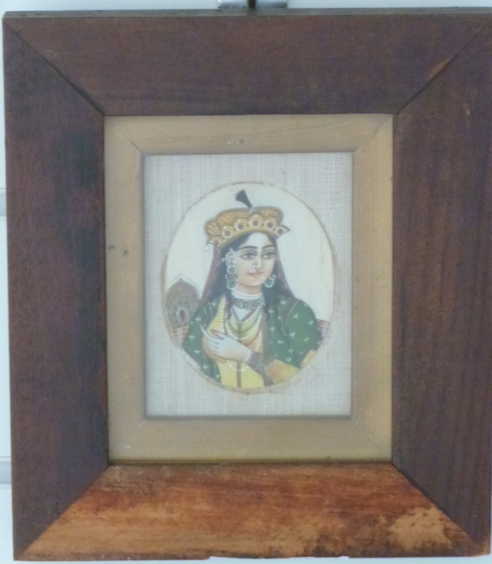 A 19thC Indian ivory portrait miniature of a lady with head dress, 8 x 6cm - Image 2 of 2