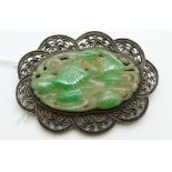 A silver filigree brooch set with carved jadeite, 5.5 x 4cm