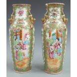 A pair of 19thC Chinese famille rose vases decorated with court scenes, Dog of Fo handles and