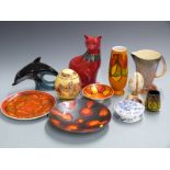 A collection of ceramics including Poole pottery cat and dolphin, decorated egg etc, tallest 30cm