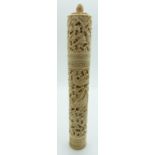 A 19thC Chinese carved ivory needle case depicting a dragon, birds and insects, with needles, H16cm