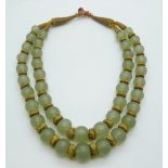 An 18th/19thC Chinese jade beaded necklace interspersed with gilt threaded beads and fastening,