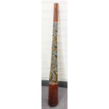An indigenous peoples of Australia didgeridoo with painted decoration depicting a lizard and