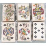 Six packs of 19th century continental playing cards to include German scenic aces another with