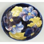Moorcroft pedestal bowl decorated in the Clematis pattern on a blue ground, impressed marks and
