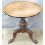 A circular oak table with carved legs, diameter 48 x H48cm