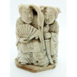 Japanese Meiji period or earlier okimono depicting a man and woman with pegged removal base, 6.5cm