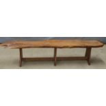 A naturistically styled yew bench, W170 x D32 x H35cm