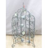 An ornate patinated metal twelve bottle wine rack, H70cm