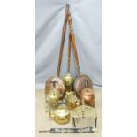 Copper and brass ware including three bed warmers, spirit kettle, watering can, copper spirit