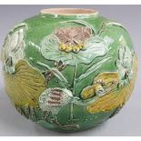 A late 19thC Chinese green glaze ginger jar with crane and floral decoration in relief by Wang