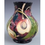 Moorcroft pedestal baluster vase decorated with peaches, figs and grapes, dated 2000, H15cm