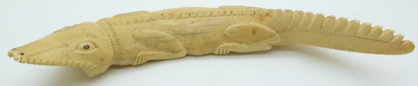 An early 20thC ivory crocodile, 21cm